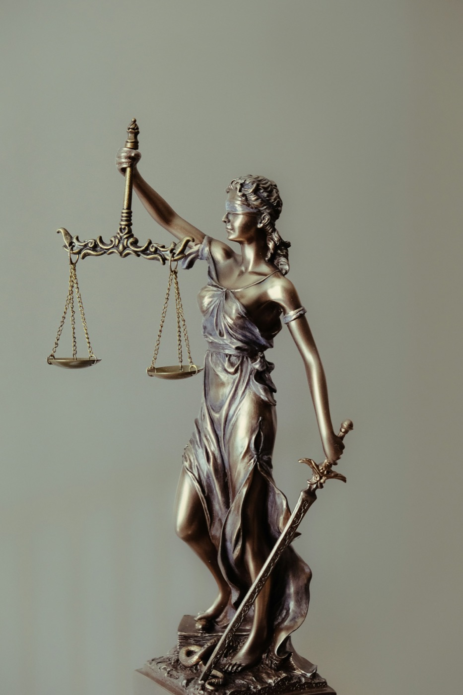 Statue of Lady Justice holding scales and a sword
